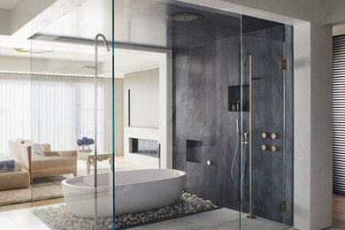 Inspiration for a contemporary bathroom in Orange County with a freestanding tub, a curbless shower, gray tile, beige floor and a hinged shower door.