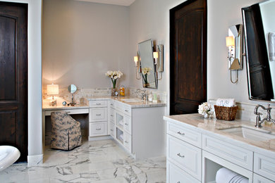 Inspiration for a large contemporary master bathroom in Phoenix with white cabinets, marble benchtops, a claw-foot tub, a double shower, white tile, beige walls and ceramic floors.
