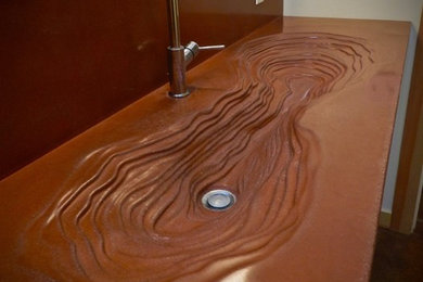 Example of a mid-sized eclectic master brown tile and ceramic tile ceramic tile alcove shower design in San Francisco with shaker cabinets, light wood cabinets, beige walls, an integrated sink and concrete countertops