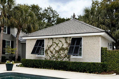 Example of a pool house design in Other