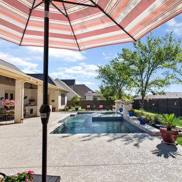 Custom Pool with Tiled Spa, Firebowls, Fireplace and Travertine Coping