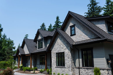 Inspiration for a large timeless stone exterior home remodel in Vancouver