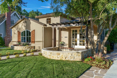 Mediterranean beige stucco exterior home idea in San Francisco with a mixed material roof