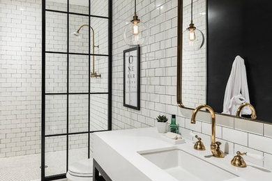 Photo of a mid-sized transitional master bathroom in Phoenix with open cabinets, black cabinets, an open shower, a two-piece toilet, black and white tile, subway tile, black walls, mosaic tile floors, an undermount sink and engineered quartz benchtops.
