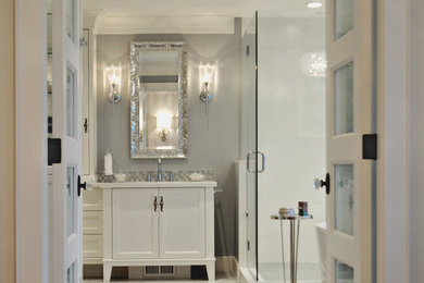Large elegant master gray tile and stone tile marble floor bathroom photo in Vancouver with recessed-panel cabinets, white cabinets, a two-piece toilet, gray walls, an undermount sink and quartz countertops