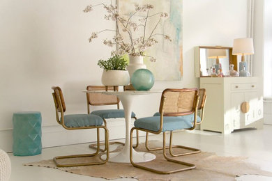 Mid-sized minimalist concrete floor and white floor dining room photo in Other with white walls and no fireplace