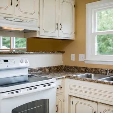 Kitchen with New Countertops and Distressed Cabinets