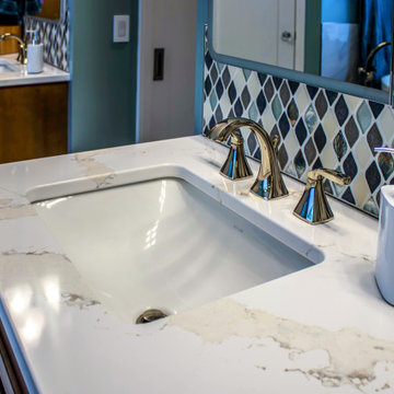 Primary Bath with Marble Look Tiled Shower and Free Standing Tub