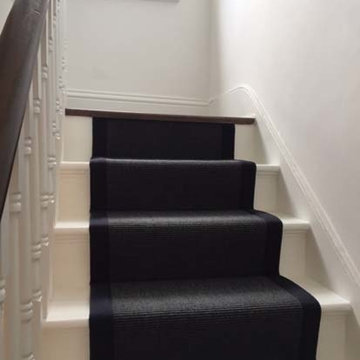Black Carpet with Black Binding Installed to Stairs