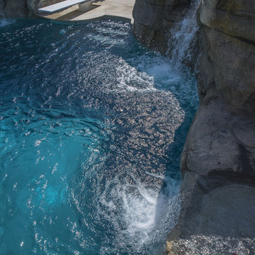 Swimming Pool with Diving Board and Stone GRotto
