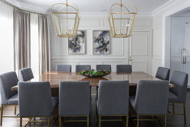 This is an example of a transitional open plan dining in New York with dark hardwood floors, grey walls and decorative wall panelling.