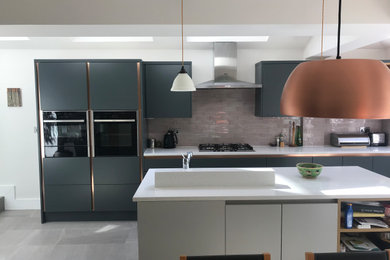 Design ideas for a contemporary kitchen in London with an island.