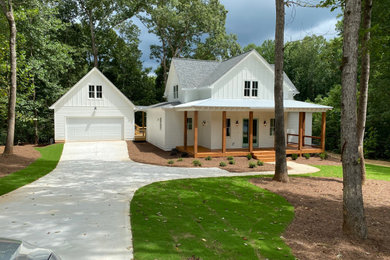 Large farmhouse home design photo in Atlanta
