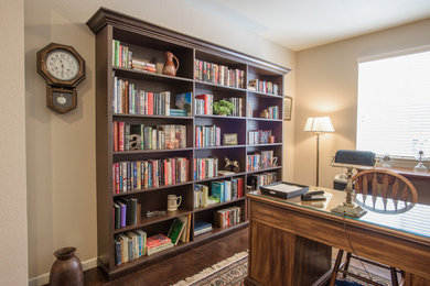 Inspiration for a small timeless freestanding desk dark wood floor study room remodel in Denver with beige walls