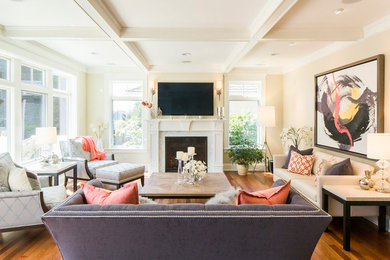 Inspiration for a small transitional enclosed medium tone wood floor and brown floor living room remodel in Seattle with beige walls, a standard fireplace, a wall-mounted tv and a plaster fireplace