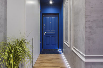 Inspiration for a small industrial front door in Moscow with grey walls, laminate floors, a single front door, a blue front door and beige floor.