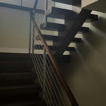 Open riser stairs with stainless steel cable wire railing