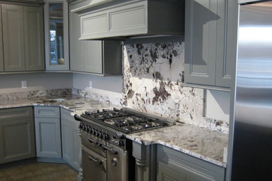 Mid-sized trendy u-shaped ceramic tile eat-in kitchen photo in Other with recessed-panel cabinets, gray cabinets, an undermount sink, granite countertops, multicolored backsplash, stone slab backsplash, stainless steel appliances and an island