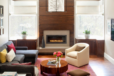 Inspiration for a large contemporary family room in San Francisco with grey walls, dark hardwood floors, a ribbon fireplace, a wood fireplace surround and grey floor.