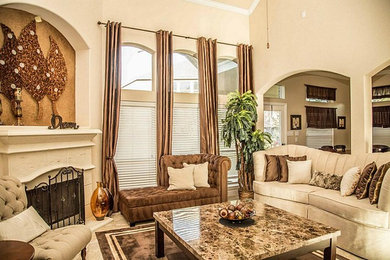 Mid-sized elegant open concept ceramic tile and beige floor living room photo in Houston with beige walls, a standard fireplace, a stone fireplace and no tv