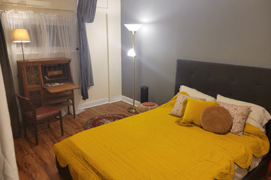 Example of a small tuscan guest dark wood floor and brown floor bedroom design in Austin