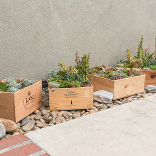 Photo of a small country side yard partial sun garden for spring in Orange County with a container garden.