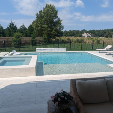 Lewes, DE - Modern, Clean Line Pool with Large Tanning Ledge & Elevated Spa