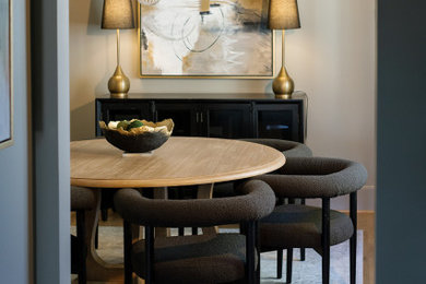 Kitchen/dining room combo - mid-sized transitional light wood floor and brown floor kitchen/dining room combo idea in Birmingham with gray walls