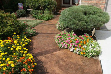 Inspiration for a mid-sized full sun front yard concrete paver garden path in Detroit.