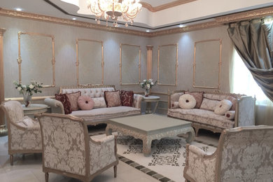 Ornate formal and enclosed living room photo in Other with green walls