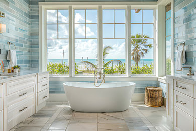 Freestanding bathtub - large modern master blue tile and glass tile marble floor, white floor, double-sink and coffered ceiling freestanding bathtub idea in Charlotte with shaker cabinets, white cabinets, a two-piece toilet, blue walls, a drop-in sink, marble countertops, white countertops and a built-in vanity