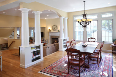 Inspiration for a mid-sized timeless light wood floor and brown floor great room remodel in Boston with beige walls, a standard fireplace and a tile fireplace