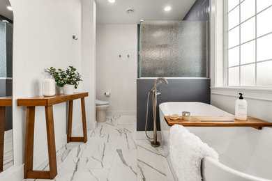 Bathroom - transitional master gray tile and porcelain tile porcelain tile, white floor and double-sink bathroom idea in Seattle with raised-panel cabinets, gray cabinets, a bidet, gray walls, an undermount sink, quartz countertops, white countertops, a niche and a built-in vanity