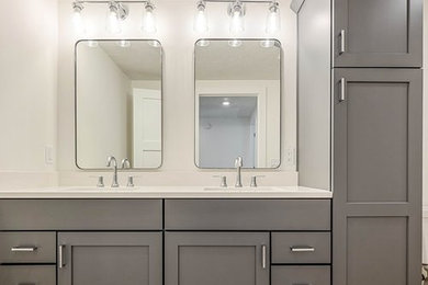 Master double-sink bathroom photo in Other with flat-panel cabinets, gray cabinets, an undermount sink and a built-in vanity
