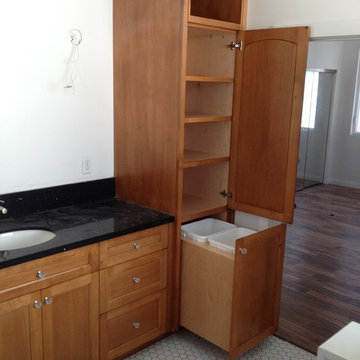 Cable residence master vanity in Alder with upright linen with display opening a