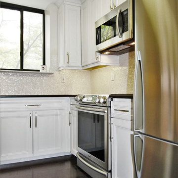 Clean SEASHELL backsplash is subtle and warm, breaking up that steril white feel