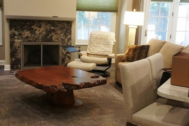 Example of a mid-sized transitional open concept dark wood floor living room design in Charlotte with beige walls, a standard fireplace and a stone fireplace