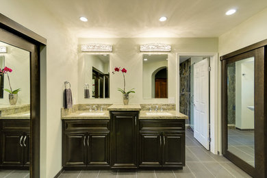 Large transitional master green tile and porcelain tile porcelain tile double shower photo in San Francisco with an undermount sink, raised-panel cabinets, dark wood cabinets, granite countertops, a two-piece toilet and green walls