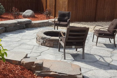Patio - rustic side yard concrete paver patio idea in Other