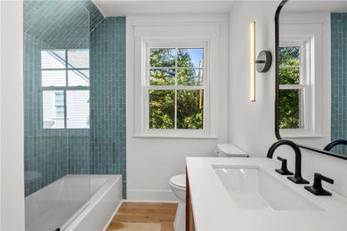 Inspiration for a mid-sized contemporary turquoise tile and ceramic tile single-sink bathroom remodel in Atlanta with flat-panel cabinets, medium tone wood cabinets, quartz countertops, white countertops and a freestanding vanity