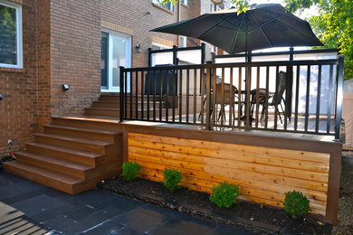 Inspiration for a mid-sized contemporary backyard deck in Ottawa with no cover.