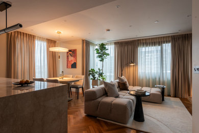 Design ideas for a medium sized contemporary open plan living room in London with white walls and a built-in media unit.