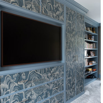 Bespoke fitted wardrobes with wallpapered panels