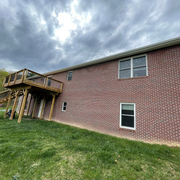 Deck stain and gutters powerwash