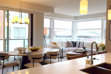 Kitchen/dining room combo - small transitional medium tone wood floor and brown floor kitchen/dining room combo idea in Calgary with beige walls