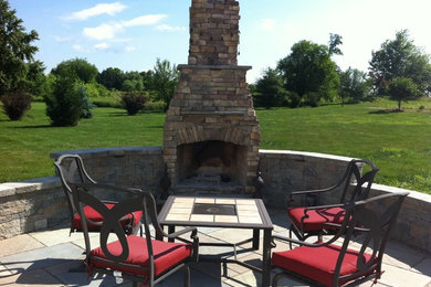 Patio - mid-sized traditional backyard tile patio idea in Philadelphia with a fire pit and no cover