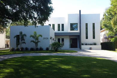 Inspiration for a contemporary two-story stucco exterior home remodel in Tampa
