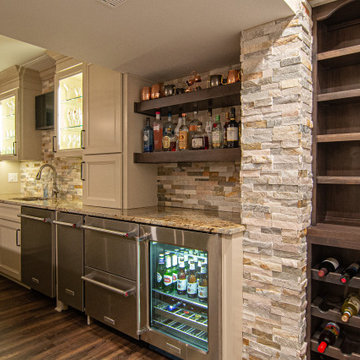 Basement Showing Warm Colors, Straight Lined Cabinets and Stacked Stone