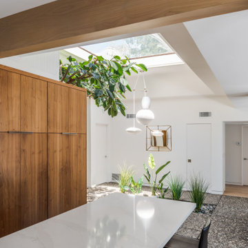 Book Matched Walnut Cabinets Compliment Walnut Wrapped Exposed Beams