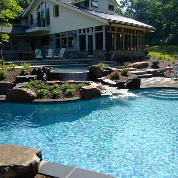 Delaware Township custom pool and raised spa with negative edge & water feature